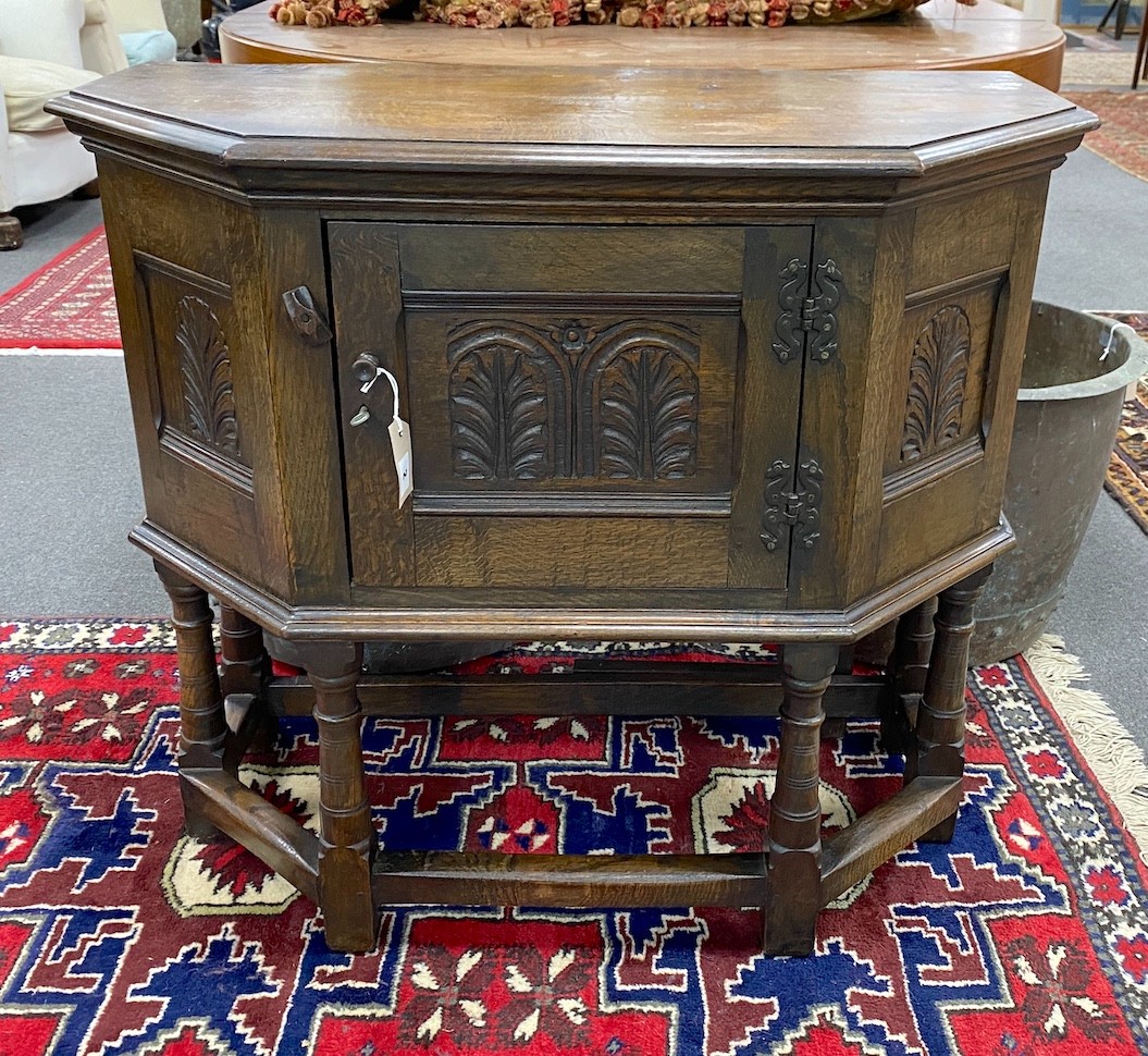 A 17th century style oak credence table, width 86cm, depth 79cm (extended), height 78cm